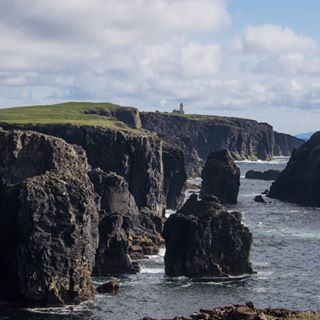  Eshaness, #Shetland. Incredible volcanic cliffs, black and gnarly. This photo was taken on a calm summer's day, last June. #eshaness #eshanesscliffs #inspiredbyshetland #promoteshetland #visitscotland #Shetlandphotography #lighthouse #guardiantravelsnaps #naturelovers #instatravel #latergram #scotspirit #traveldeeper #BBCtravel #wild #getoutstayout #coastal 